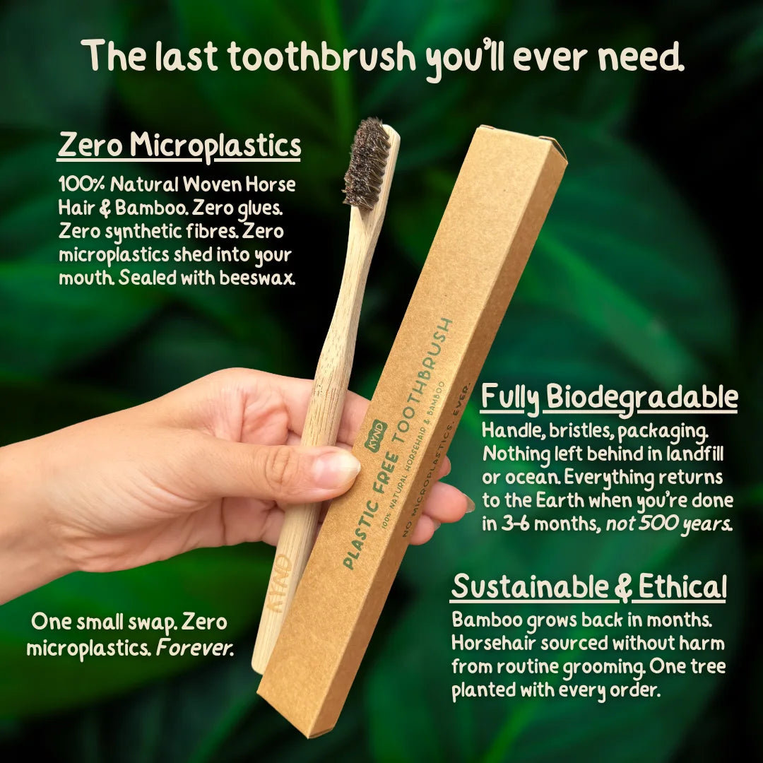 KYND bamboo and horsehair toothbrush and packaging held by a hand with sustainability information text.